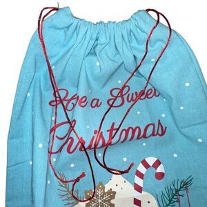 Santa canvas gift bag with hot cocoa have a sweet Christmas logo